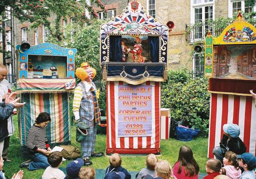 Children enjoy the Punch and Judy show 