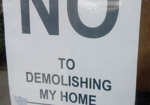 One of the posters opposing demolition