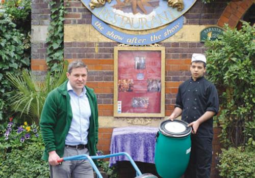 Mr Hurton, left, is pictured with the Sarastro staff member Dilshod Karimov