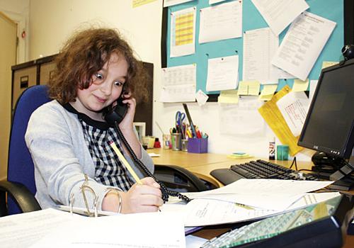 Pupil Mercedes in the headteacher’s seat at Soho Parish School