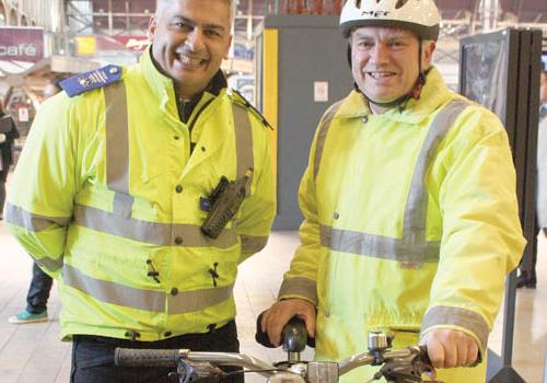 PCSO Halil Abdullah with cyclist Andrew Briggs in Paddington