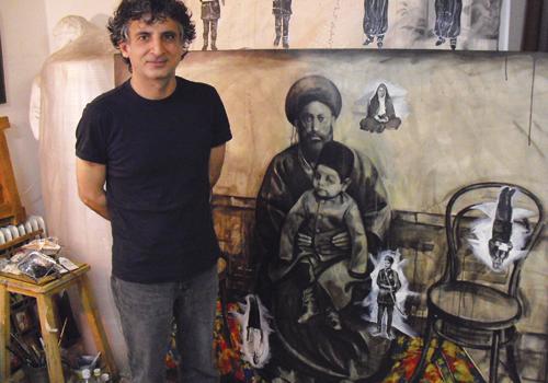 Khosro Khosravi in his studio with his painting Silent