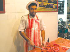 Butcher Mohammad Hussan at the meat counter in Chalk Farm Morrisons